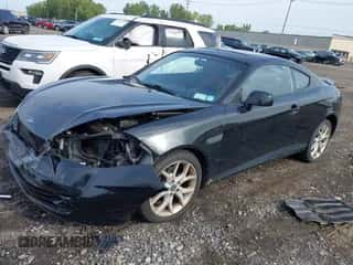 ✅ 2008 Hyundai Tiburon GT • VIN: KMHHN66FX8U268394 • Лот: 43293640. Опубликован ранее на IAAI с пробегом 66 751 миль. Бесплатный доступ к архиву аукционных продаж из США и подробный отчёт об истории автомобиля на DreamBid. Изображение 2.