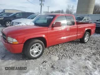 2001 Dodge Dakota Sport z VIN 1B7GL22Z11S337120, wystawiony jako Copart lot #89385605 z przebiegiem 71 182 mil mil oraz Czysty tytuł • Clean title. Historia ofert i sprzedaży dostępna na DreamBid. Obrazek 1.