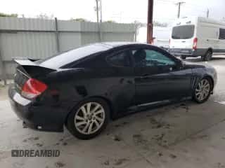 2005 Hyundai Tiburon GT z VIN KMHHN65F55U175179, wystawiony jako Copart lot #89319685 z przebiegiem 220 117 mil mil oraz Czysty tytuł • Clean title. Historia ofert i sprzedaży dostępna na DreamBid. Obrazek 3.