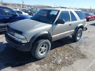✅ 2000 Chevrolet Blazer LS • VIN: 1GNCT18W7YK298489 • Lot: 41422643. Wystawiony na IAAI z przebiegiem 194 207 mil. Bezpłatny archiwum sprzedaży aukcyjnych z USA i szczegółowy raport historii pojazdu na DreamBid. Zdjęcie 2.