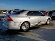 ✅ 2010 Ford Fusion Hybrid • VIN: 3FADP0L31AR277041 • Lot: 90712635. Wystawiony na Copart z przebiegiem 127 672 mil. Bezpłatny archiwum sprzedaży aukcyjnych z USA i szczegółowy raport historii pojazdu na DreamBid. Zdjęcie 3.