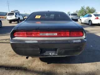 2012 Dodge Challenger SXT z VIN 2C3CDYAG3CH294428, wystawiony jako Copart lot #59977455 z przebiegiem 189 417 mil mil oraz Szkoda całkowita • Salvage title. Historia ofert i sprzedaży dostępna na DreamBid. Obrazek 6.