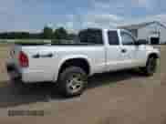 2003 Dodge Dakota Sport z VIN 1D7HG32NX3S345172, wystawiony jako Copart lot #65775335 z przebiegiem 169 253 mil mil oraz Szkoda całkowita • Salvage title. Historia ofert i sprzedaży dostępna na DreamBid. Obrazek 3.