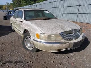 ✅ 1999 Lincoln Continental • VIN: 1LNHM97V0XY693527 • Lot: 43362254. Wystawiony na IAAI z przebiegiem 65 127 mil. Bezpłatny archiwum sprzedaży aukcyjnych z USA i szczegółowy raport historii pojazdu na DreamBid. Zdjęcie 1.
