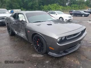✅ 2012 Dodge Challenger SRT-8 392 • VIN: 2C3CDYCJ5CH122880 • Lot: 42165109. Wystawiony na IAAI z przebiegiem 103 973 mil. Bezpłatny archiwum sprzedaży aukcyjnych z USA i szczegółowy raport historii pojazdu na DreamBid. Zdjęcie 1.