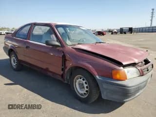✅ 1996 Toyota Tercel DX • VIN: JT2AC52L8T0124403 • Lot: 66195834. Listed on Copart with 137,467 mi. Free auction sales archive from the USA and detailed vehicle history report at DreamBid. Image 4.