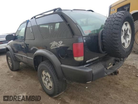 2003 Chevrolet Blazer LS с VIN 1GNCT18X23K154091, выставлен на аукционе Copart как лот 41507405 с пробегом 166 019 миль миль и Списание • Salvage title. История ставок и продаж доступна на DreamBid. Изображение 2.