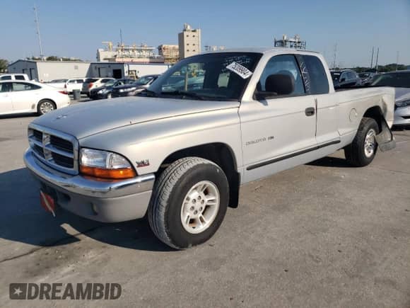 1999 Dodge Dakota SLT z VIN 1B7GL22X0XS315391, wystawiony jako Copart lot #75209904 z przebiegiem 181 336 mil mil oraz Szkoda całkowita • Salvage title. Historia ofert i sprzedaży dostępna na DreamBid. Obrazek 1.