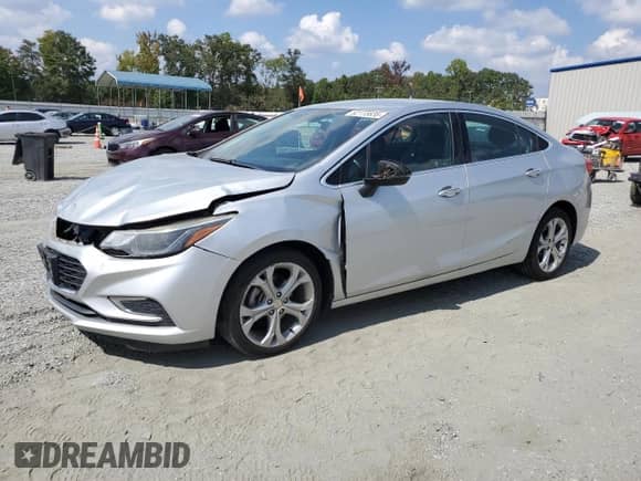 2016 Chevrolet Cruze Premier with VIN 1G1BG5SM0G7269465, listed as a Copart auction lot 82115635 with 143,928 mi miles and Salvage title. Bid and sale history available at DreamBid. Image 1.