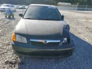 ✅ 1999 Mazda Protege DX • VIN: JM1BJ2222X0126273 • Lot: 75479364. Wystawiony na Copart z przebiegiem 293 952 mil. Bezpłatny archiwum sprzedaży aukcyjnych z USA i szczegółowy raport historii pojazdu na DreamBid. Zdjęcie 5.