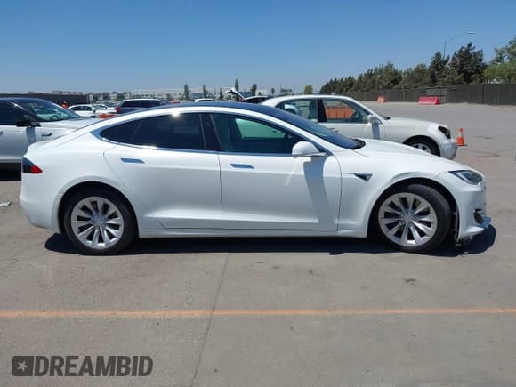 ✅ 2017 Tesla Model S 60 • VIN: 5YJSA1E19HF215502 • Lot: 42667040. Listed on IAAI with 74,627 mi. Free auction sales archive from the USA and detailed vehicle history report at DreamBid. Image 14.
