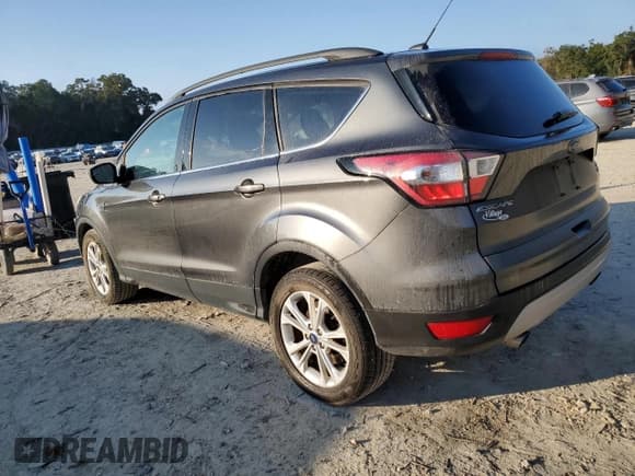 ✅ 2018 Ford Escape SE • VIN: 1FMCU0GD7JUC27721 • Lot: 93012415. Listed on Copart with 144,625 mi. Free auction sales archive from the USA and detailed vehicle history report at DreamBid. Image 2.