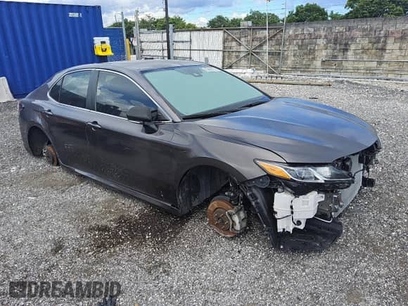 2023 Toyota Camry Hybrid LE with VIN 4T1C31AK3PU608653, listed as a Copart auction lot 59235965 with 57,095 mi miles and Clean title. Bid and sale history available at DreamBid. Image 4.