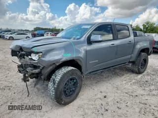 ✅ 2020 Chevrolet Colorado 4WD ZR2 • VIN: 1GCGTEEN2L1245906 • Lot: 85357695. Listed on Copart with 90,402 mi. Free auction sales archive from the USA and detailed vehicle history report at DreamBid. Image 1.
