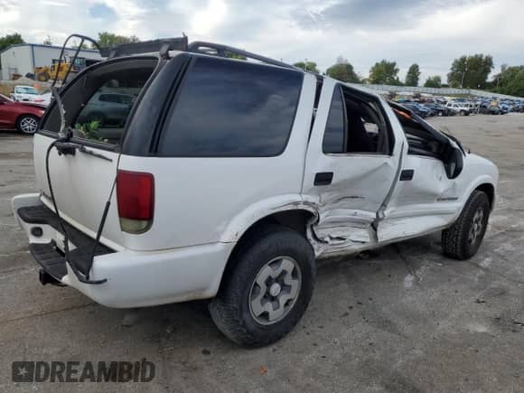 2004 Chevrolet Blazer LS z VIN 1GNDT13X84K162371, wystawiony jako Copart lot #71074684 z przebiegiem 273 070 mil mil oraz Szkoda całkowita • Salvage title. Historia ofert i sprzedaży dostępna na DreamBid. Obrazek 3.