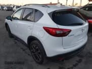 ✅ 2016 Mazda CX-5 Grand Touring • VIN: JM3KE2DY3G0863303 • Lot: 43848862. Wystawiony na IAAI z przebiegiem 95 498 mil. Bezpłatny archiwum sprzedaży aukcyjnych z USA i szczegółowy raport historii pojazdu na DreamBid. Zdjęcie 3.