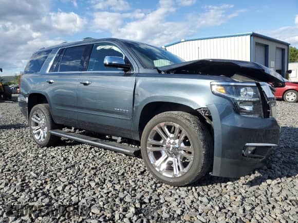 2020 Chevrolet Tahoe Premier with VIN 1GNSKCKJ0LR101198, listed as a Copart auction lot 84955895 with 99,414 mi miles and Salvage title. Bid and sale history available at DreamBid. Image 4.