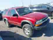 1999 Chevrolet Blazer LS z VIN 1GNCT18W6XK240758, wystawiony jako IAAI lot #42729667 z przebiegiem Nie podano mil oraz . Historia ofert i sprzedaży dostępna na DreamBid. Obrazek 1.