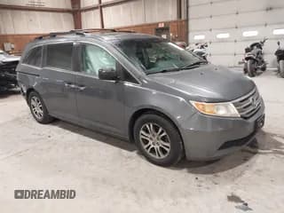✅ 2012 Honda Odyssey EX-L • VIN: 5FNRL5H67CB100705 • Lot: 43821207. Listed on IAAI with 105,432 mi. Free auction sales archive from the USA and detailed vehicle history report at DreamBid. Image 1.