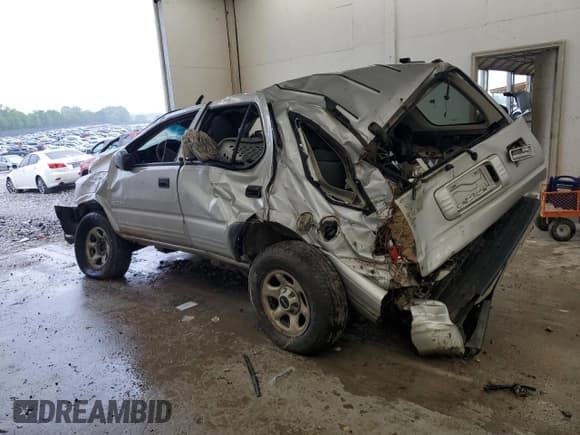 ✅ 2002 Isuzu Rodeo • VIN: 4S2DM58W924331185 • Лот: 62650715. Опубликован ранее на Copart с пробегом Не указан. Бесплатный доступ к архиву аукционных продаж из США и подробный отчёт об истории автомобиля на DreamBid. Изображение 2.