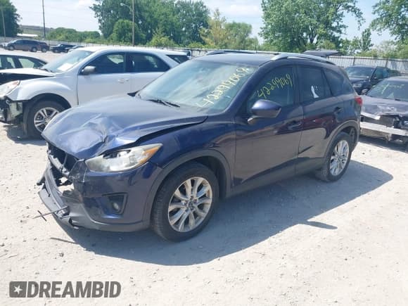 ✅ 2014 Mazda CX-5 Grand Touring • VIN: JM3KE2DY5E0380232 • Лот: 42299069. Опубликован ранее на IAAI с пробегом 154 496 миль. Бесплатный доступ к архиву аукционных продаж из США и подробный отчёт об истории автомобиля на DreamBid. Изображение 2.