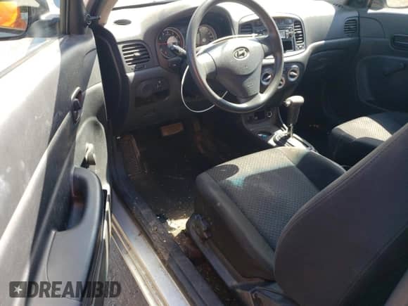 2010 Hyundai Accent L with VIN KMHCN3BCXAU182917, listed as a Copart auction lot 69464685 with 124,678 mi miles and Salvage title. Bid and sale history available at DreamBid. Image 8.