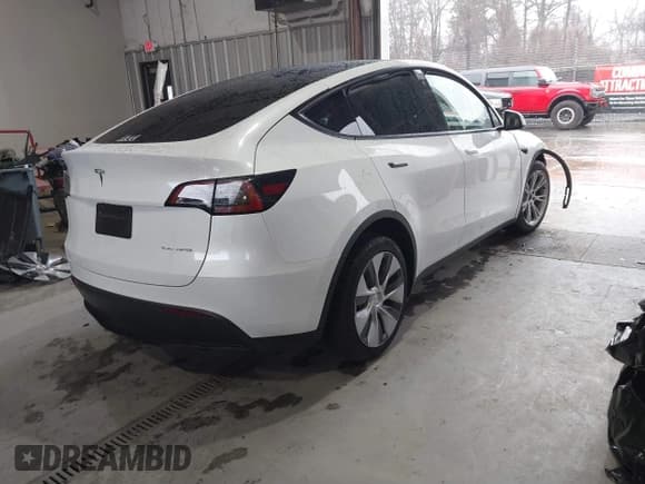 ✅ 2023 Tesla Model Y Long Range • VIN: 7SAYGAEEXPF789037 • Lot: 41551605. Listed on IAAI with 8,630 mi. Free auction sales archive from the USA and detailed vehicle history report at DreamBid. Image 4.