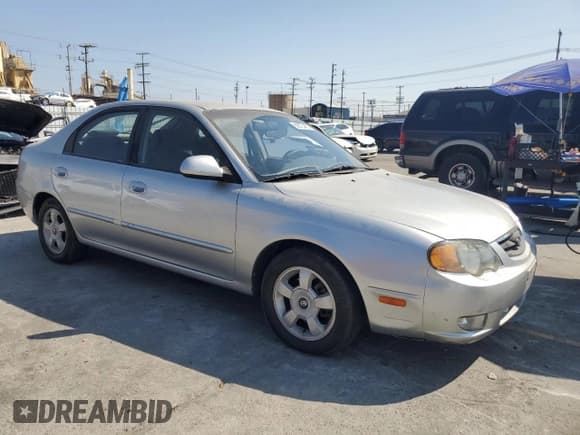 ✅ 2003 Kia Spectra GS • VIN: KNAFB161635094836 • Lot: 62873465. Listed on Copart with 117,872 mi. Free auction sales archive from the USA and detailed vehicle history report at DreamBid. Image 4.