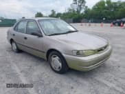 ✅ 1999 Toyota Corolla VE • VIN: 2T1BR12E3XC246635 • Lot: 42910962. Listed on IAAI with 252,704 mi. Free auction sales archive from the USA and detailed vehicle history report at DreamBid. Image 1.