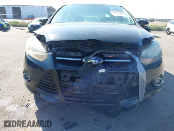 ✅ 2014 Ford Focus Titanium • VIN: 1FADP3J23EL237429 • Lot: 43358765. Listed on IAAI with 138,960 mi. Free auction sales archive from the USA and detailed vehicle history report at DreamBid. Image 6.