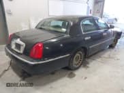 ✅ 1999 Lincoln Town Car Executive • VIN: 1LNHM81W7XY660889 • Lot: 43428648. Listed on IAAI with 186,064 mi. Free auction sales archive from the USA and detailed vehicle history report at DreamBid. Image 4.