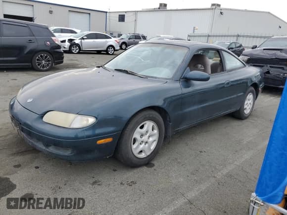 ✅ 1993 Mazda MX-6 • VIN: 1YVGE31A2P5228999 • Lot: 80751524. Wystawiony na Copart z przebiegiem 138 398 mil. Bezpłatny archiwum sprzedaży aukcyjnych z USA i szczegółowy raport historii pojazdu na DreamBid. Zdjęcie 1.