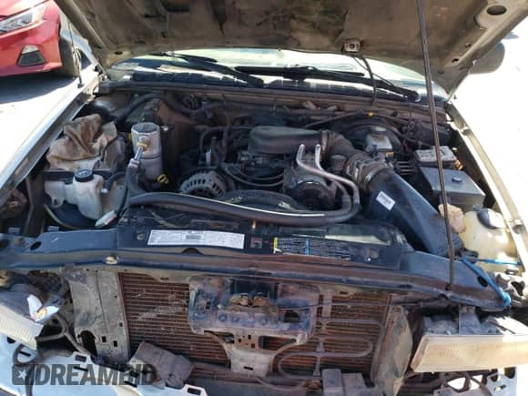 2002 Chevrolet Blazer LS z VIN 1GNDT13W22K190722, wystawiony jako Copart lot #68576164 z przebiegiem 124 420 mil mil oraz Szkoda całkowita • Salvage title. Historia ofert i sprzedaży dostępna na DreamBid. Obrazek 12.