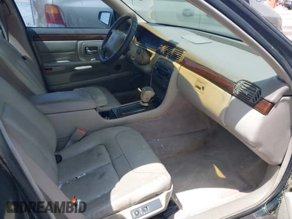 ✅ 1999 Cadillac DeVille • VIN: 1G6KF5498XU761779 • Lot: 41872157. Listed on IAAI with 107,639 mi. Free auction sales archive from the USA and detailed vehicle history report at DreamBid. Image 5.