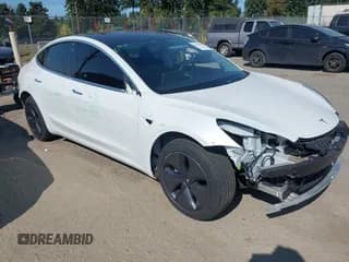 ✅ 2020 Tesla Model 3 Standard Range Plus • VIN: 5YJ3E1EA7LF660287 • Lot: 43208373. Wystawiony na IAAI z przebiegiem 18 146 mil. Bezpłatny archiwum sprzedaży aukcyjnych z USA i szczegółowy raport historii pojazdu na DreamBid. Zdjęcie 1.