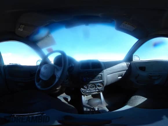 2005 Hyundai Accent GLS z VIN KMHCG45C95U620716, wystawiony jako IAAI lot #41740573 z przebiegiem 187 971 mil mil oraz . Historia ofert i sprzedaży dostępna na DreamBid. Obrazek 19.