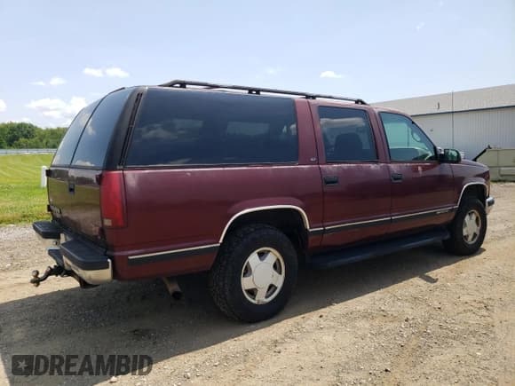 ✅ 1999 GMC Suburban • VIN: 1GKFK16R3XJ792220 • Lot: 66891295. Listed on Copart with 258,129 mi. Free auction sales archive from the USA and detailed vehicle history report at DreamBid. Image 3.