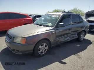 2001 Hyundai Accent GL with VIN KMHCG45C91U186811, listed as a Copart auction lot 56210515 with 79,730 mi miles and Salvage title. Bid and sale history available at DreamBid. Image 1.