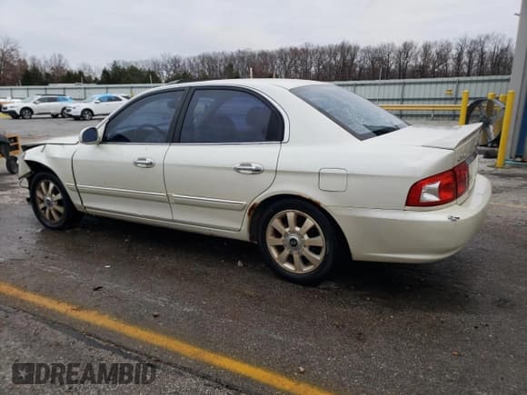 ✅ 2004 Kia Optima LX • VIN: KNAGD128745329120 • Лот: 82915464. Опубликован ранее на Copart с пробегом 167 112 миль. Бесплатный доступ к архиву аукционных продаж из США и подробный отчёт об истории автомобиля на DreamBid. Изображение 2.