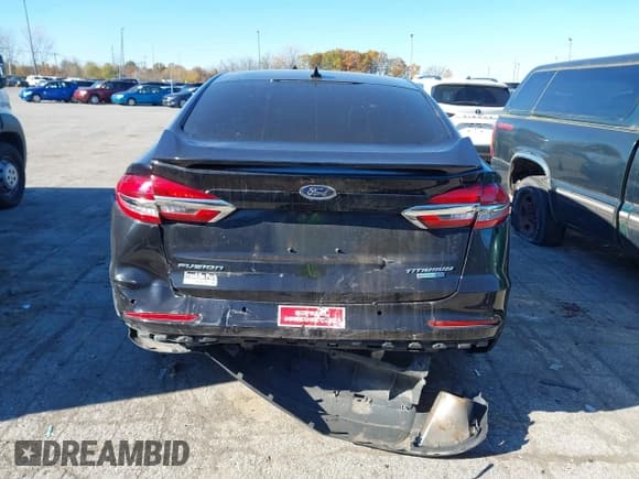 ✅ 2020 Ford Fusion Titanium • VIN: 3FA6P0D98LR174391 • Lot: 43470790. Listed on IAAI with 74,718 mi. Free auction sales archive from the USA and detailed vehicle history report at DreamBid. Image 16.
