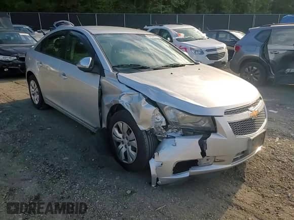 2014 Chevrolet Cruze LS z VIN 1G1PA5SH4E7202097, wystawiony jako Copart lot #84544765 z przebiegiem 184 145 mil mil oraz Szkoda całkowita • Salvage title. Historia ofert i sprzedaży dostępna na DreamBid. Obrazek 13.