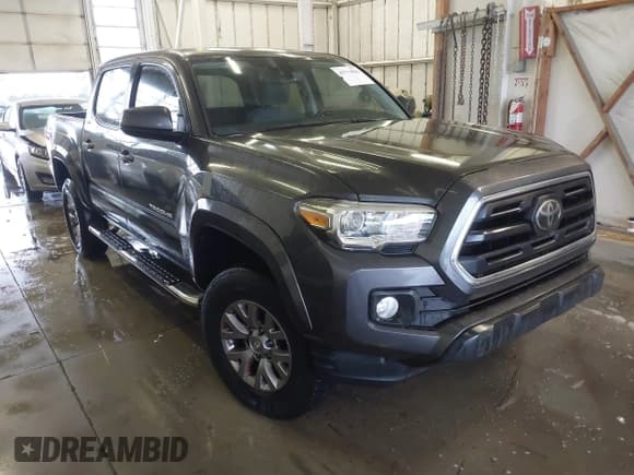 ✅ 2018 Toyota Tacoma SR5 • VIN: 3TMAZ5CNXJM074748 • Lot: 43714836. Listed on IAAI with 156,426 mi. Free auction sales archive from the USA and detailed vehicle history report at DreamBid. Image 1.