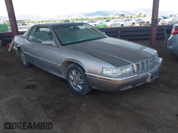✅ 1999 Cadillac Eldorado • VIN: 1G6EL12Y0XU600769 • Lot: 42765469. Wystawiony na IAAI z przebiegiem 130 882 mil. Bezpłatny archiwum sprzedaży aukcyjnych z USA i szczegółowy raport historii pojazdu na DreamBid. Zdjęcie 1.