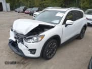 ✅ 2016 Mazda CX-5 Grand Touring • VIN: JM3KE4DY6G0873688 • Lot: 43565324. Wystawiony na IAAI z przebiegiem 80 920 mil. Bezpłatny archiwum sprzedaży aukcyjnych z USA i szczegółowy raport historii pojazdu na DreamBid. Zdjęcie 2.