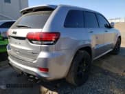 ✅ 2018 Jeep Grand Cherokee • VIN: NJ1454E • Lot: 48051693. Listed on Copart with 66,894 mi. Free auction sales archive from the USA and detailed vehicle history report at DreamBid. Image 3.