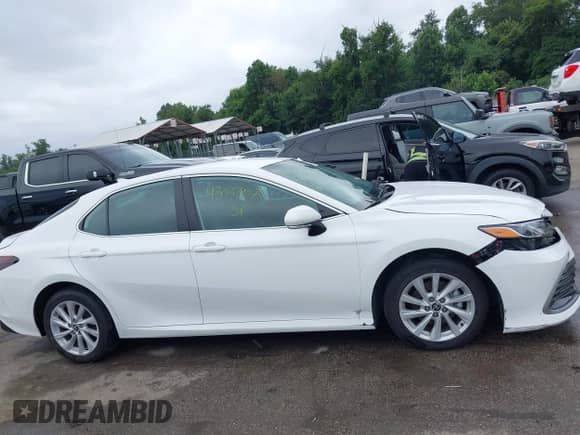 2022 Toyota Camry LE with VIN 4T1R11BK3NU064246, listed as a IAAI auction lot 43037907 with 64,971 mi miles and . Bid and sale history available at DreamBid. Image 13.