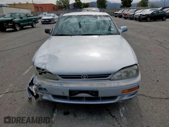 ✅ 1995 Toyota Camry LE • VIN: JT2GK12E7S0111308 • Lot: 66548415. Wystawiony na Copart z przebiegiem 237 050 mil. Bezpłatny archiwum sprzedaży aukcyjnych z USA i szczegółowy raport historii pojazdu na DreamBid. Zdjęcie 5.