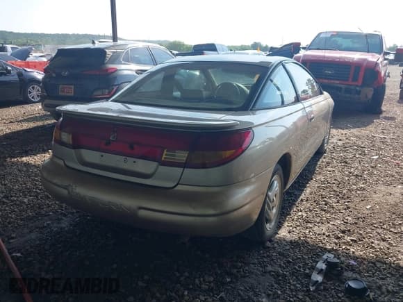 ✅ 1997 Saturn 2dr Coupe • VIN: 1G8ZH127XVZ333643 • Лот: 42463504. Опубликован ранее на IAAI с пробегом 104 295 миль. Бесплатный доступ к архиву аукционных продаж из США и подробный отчёт об истории автомобиля на DreamBid. Изображение 4.