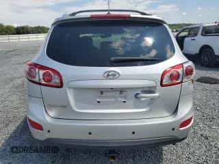 2012 Hyundai Santa Fe SE с VIN 5XYZH4AG0CG097914, выставлен на аукционе Copart как лот 67776104 с пробегом 166 992 миль миль и Списание • Salvage title. История ставок и продаж доступна на DreamBid. Изображение 6.