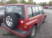 ✅ 1995 Suzuki Sidekick • VIN: JS3TD03V0S4110195 • Lot: 43259634. Listed on IAAI with 185,463 mi. Free auction sales archive from the USA and detailed vehicle history report at DreamBid. Image 4.